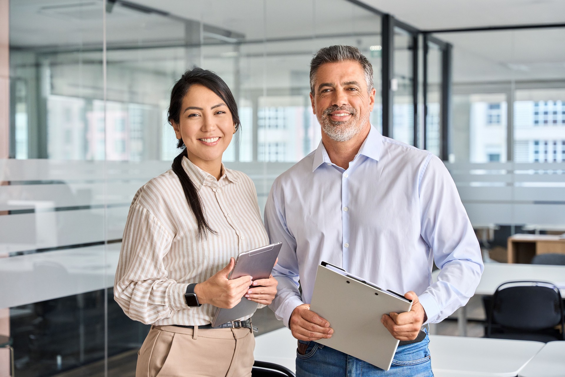 Happy diverse professional business man and woman team in office, portrait.